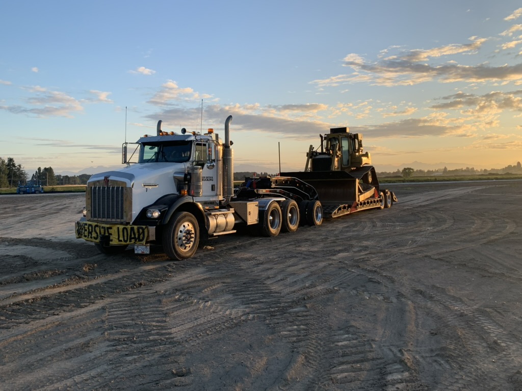 Tractor with loaded lowbed trailer